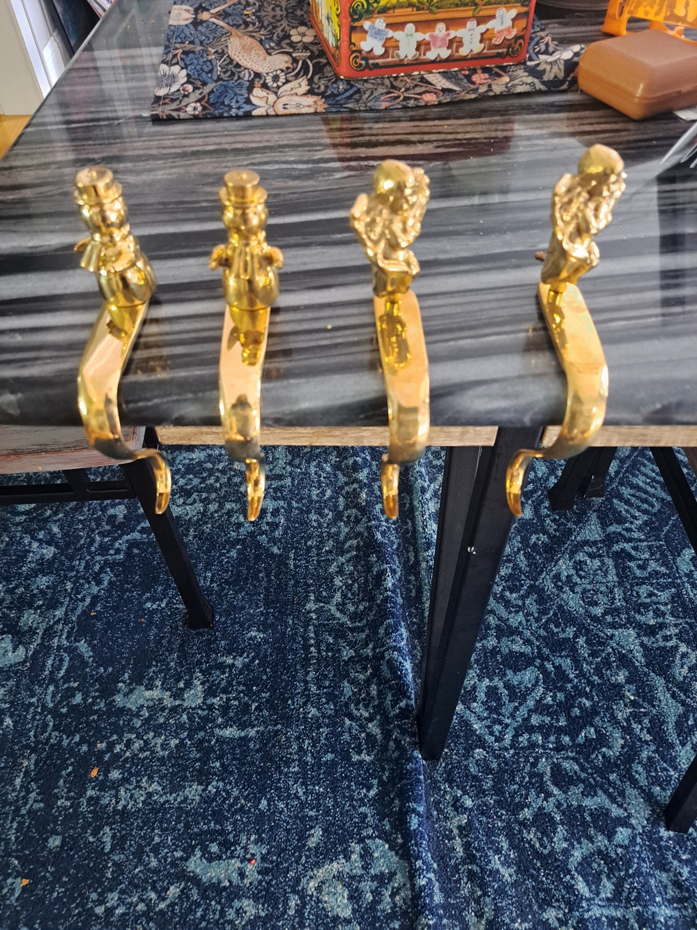 4 gift boxed solid brass Christmas stocking holders featuring holiday figures sn